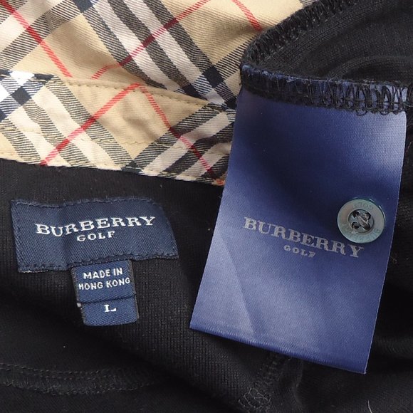 SIZE L. Burberry Golf St. Andrew’s Links shirt with Nova check collar accent. SIZE L. Burberry Golf St. Andrew’s Links shirt with Nova check collar accent.